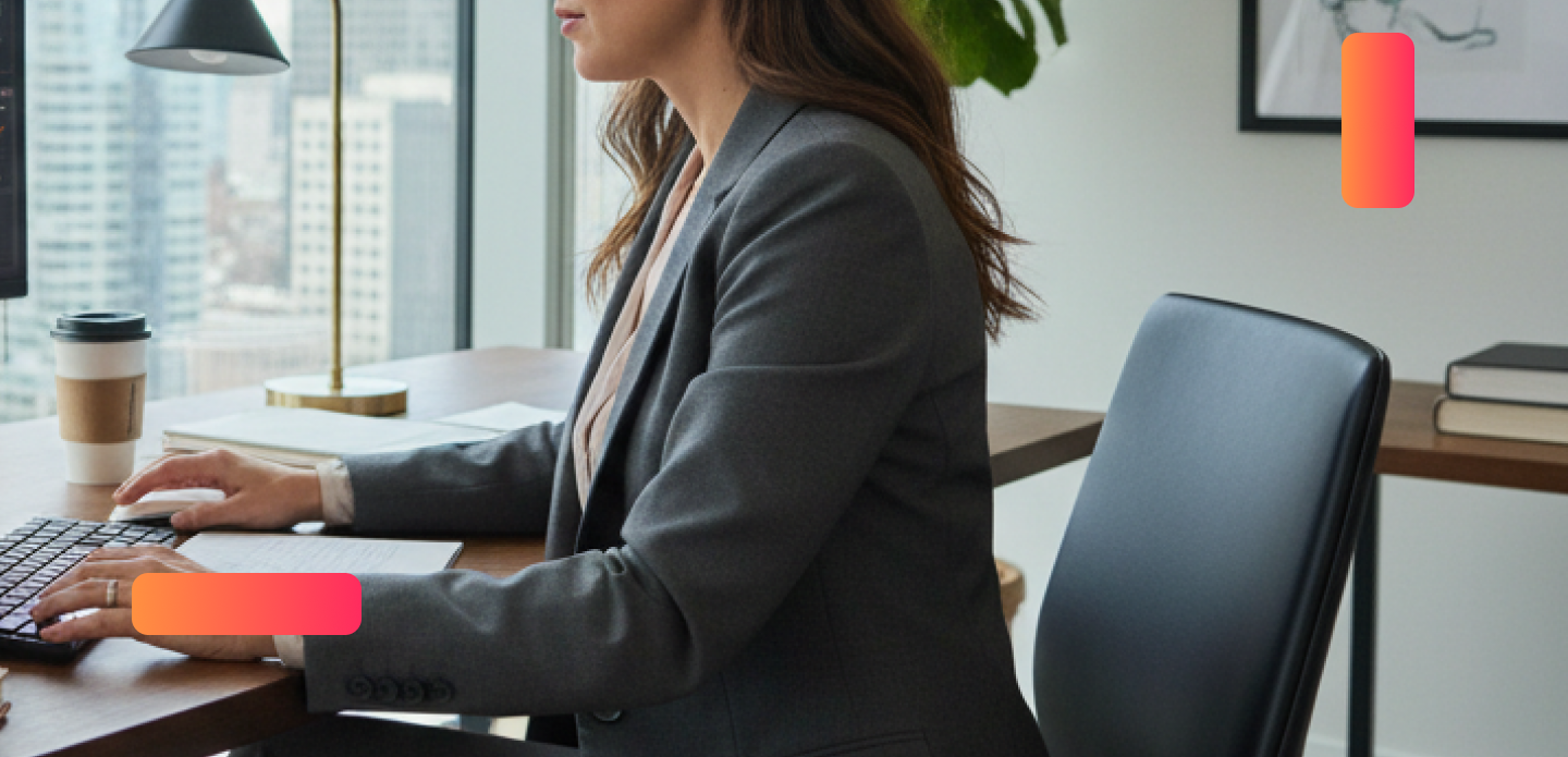young lady sitting at computer typing