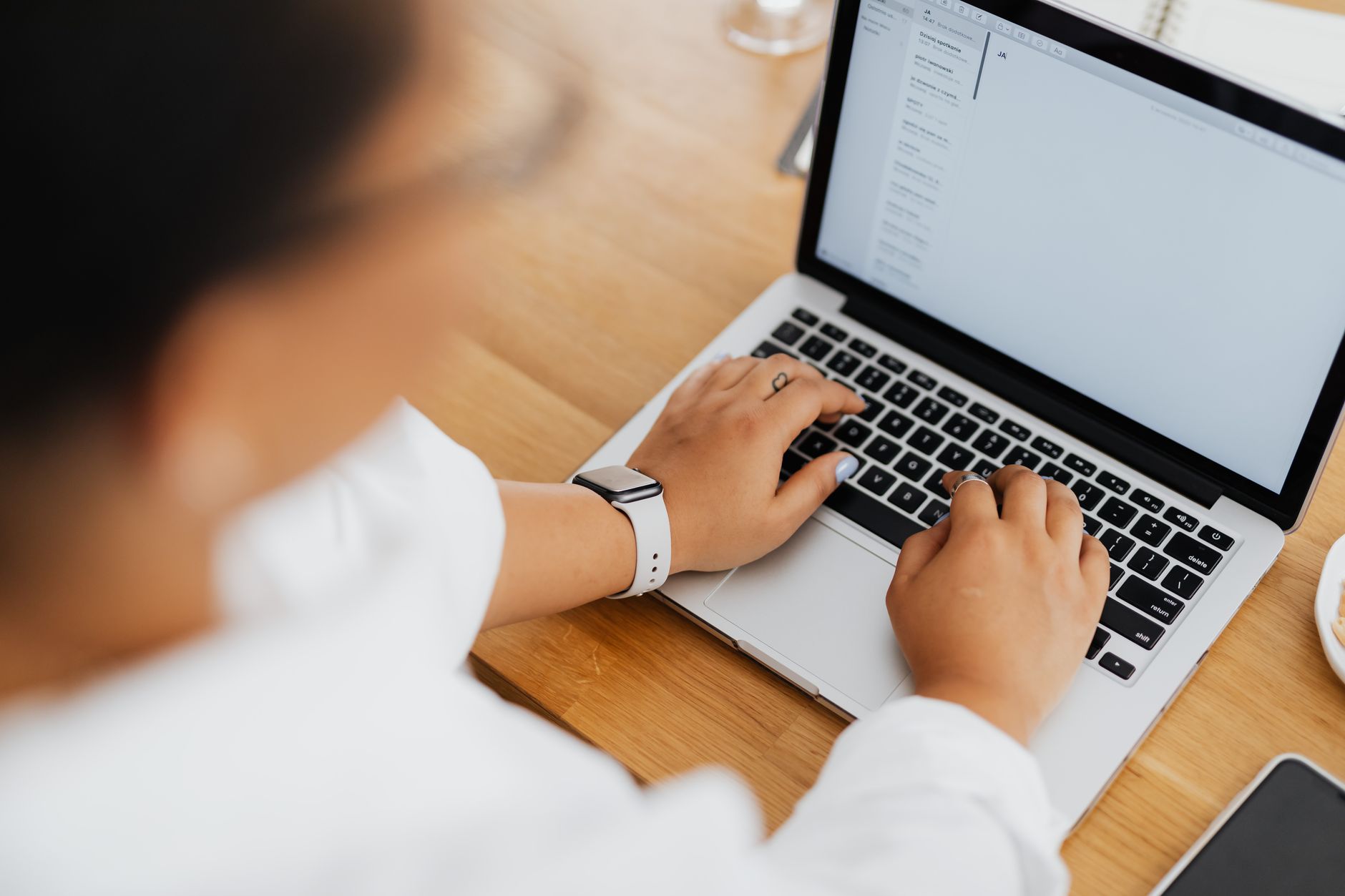 close up photo of a person typing on laptop